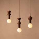 Geometrische Pendelleuchte JUNIT LAMP von Schneid in den Ausführungen COPLA, STANZA und PINO JUNIT LAMP von Schneid - geometrische Pendelleuchte aus Holz in Walnuss
