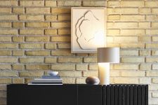 Die elegante Tischleuchte TANGENT TABLE LAMP von WOUD entsteht aus zwei unterschiedlich großen Stahlrohren, die harmonisch ineinandergreifen Elegante Tischleuchte Tangent Table Lamp von Woud